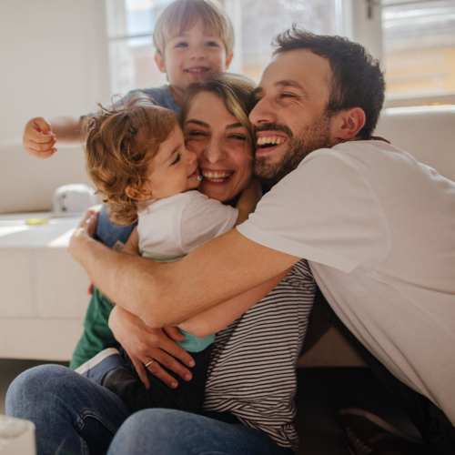 Happy family in the apartment at Keystone Trailhead Village in Reno, Nevada