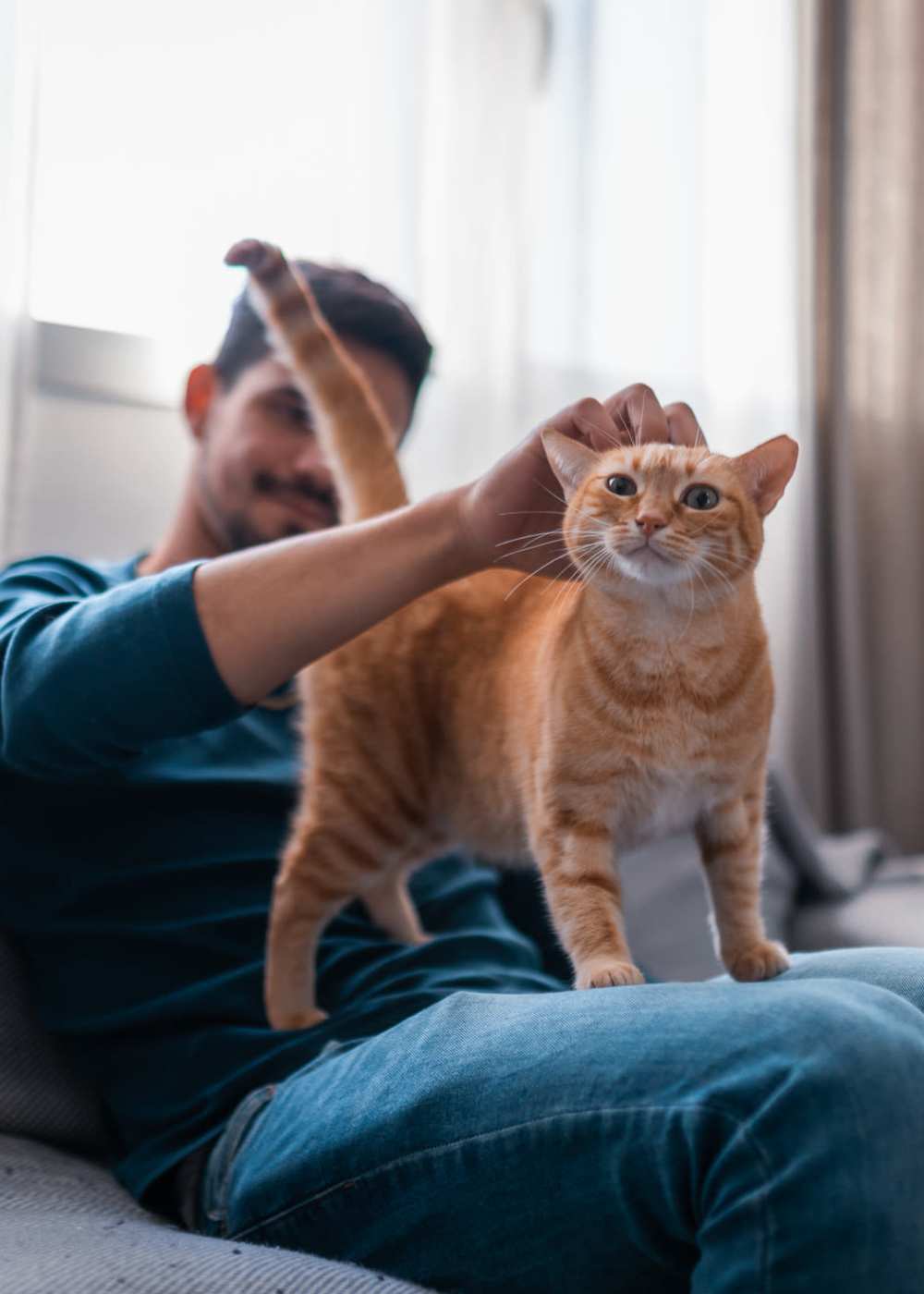 Resident with his cat in their new home at 2704 CDMX in Dallas, Texas