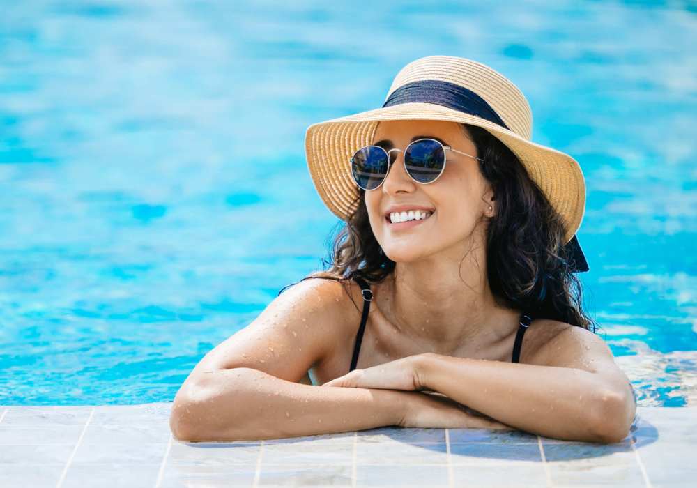 Resident taking a break from swimming laps at pool's edge at The Element At 464 in Daytona Beach, Florida