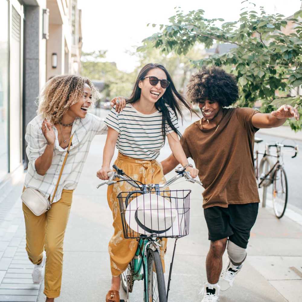 Friends enjoying a bike ride together near The Carlton At Lake Dexter in Winter Haven, Florida