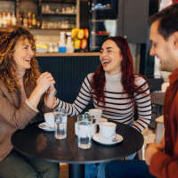 Friends having coffee near Las Torres Apartments in El Paso, Texas