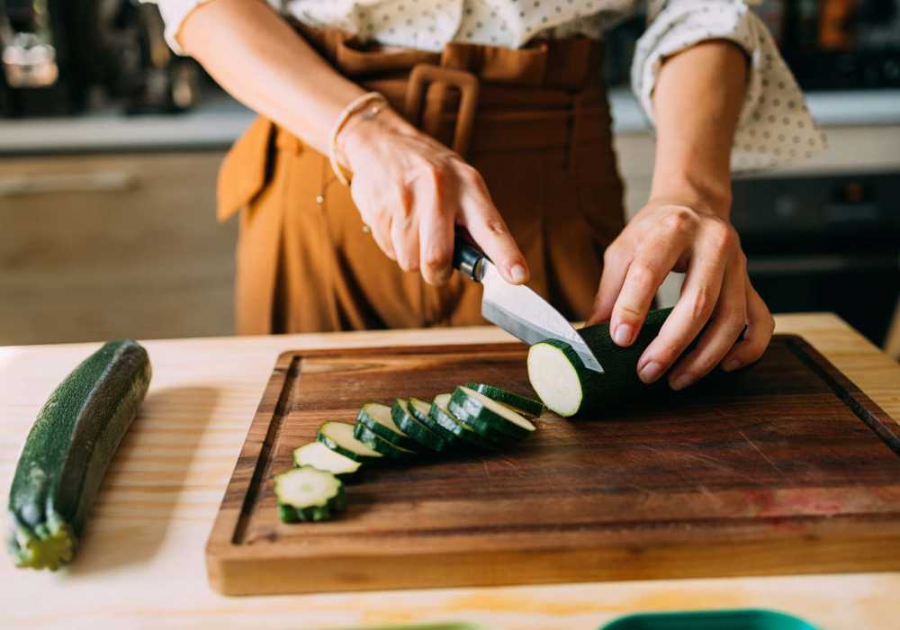 Resident chopping vegetables at Silo Creek Apartments in Lafayette, Louisiana