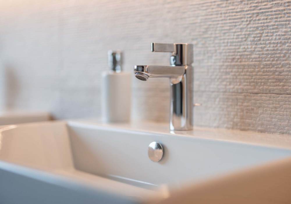 Bathroom with sink at Mount Vernon Arms Apartments in Merrillville, Indiana