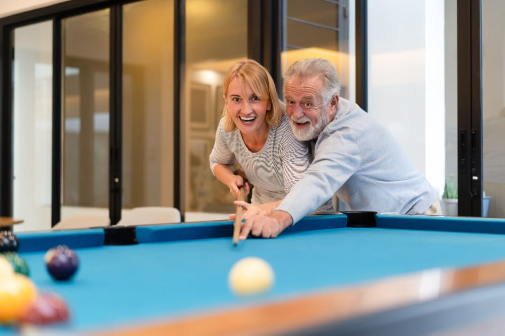 Couple playing pool at The Pinnacle at Plymouth Meeting in Plymouth Meeting, Pennsylvania