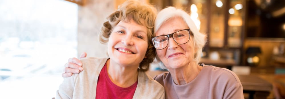 Two smiling residents at a Stoney Brook community