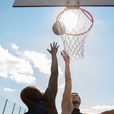 Residents playing basketball at Chollas Heights in San Diego, California