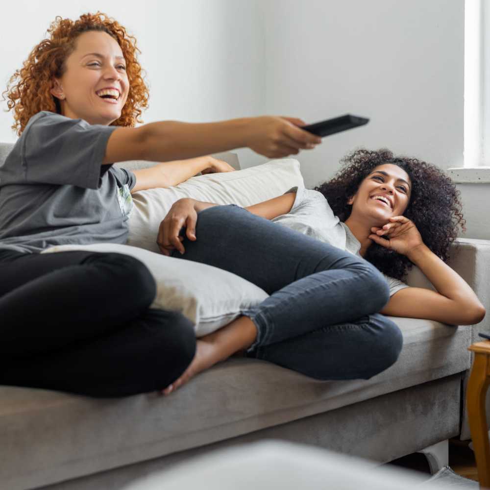 Residents watching TV in the spacious living area at Sandhill Manor in Houghton Lake, Michigan