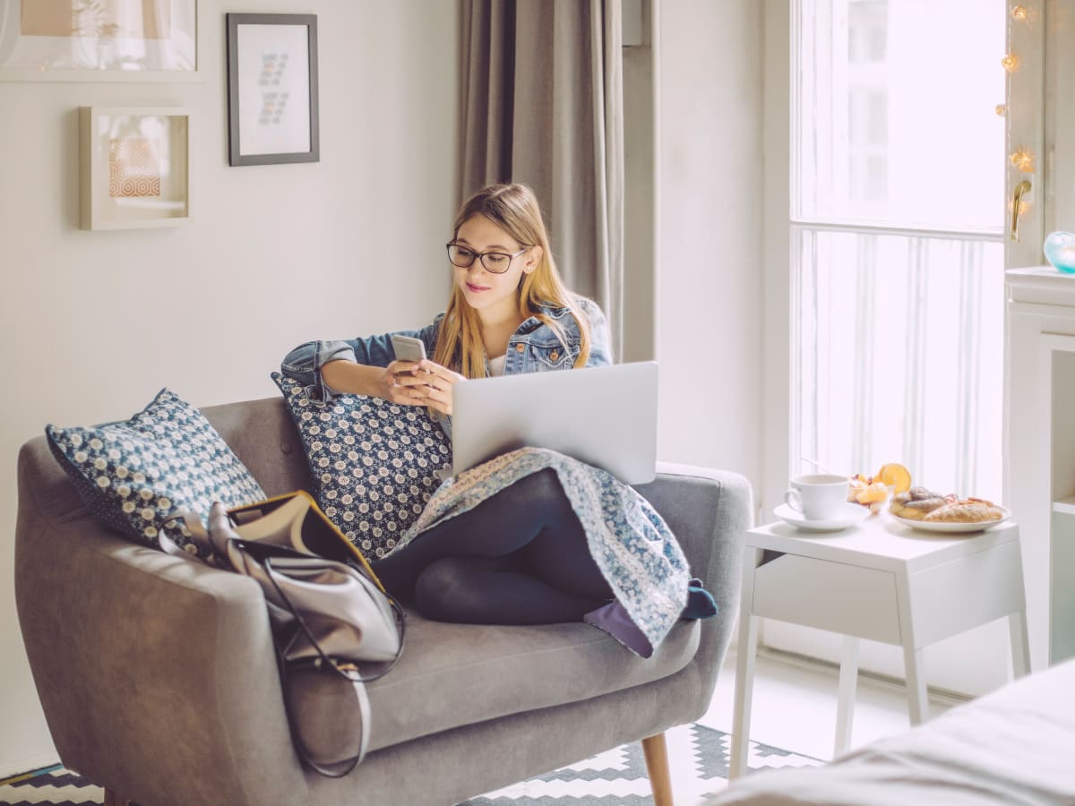 Woman working from her new home at Newport Apartments in Amarillo, Texas