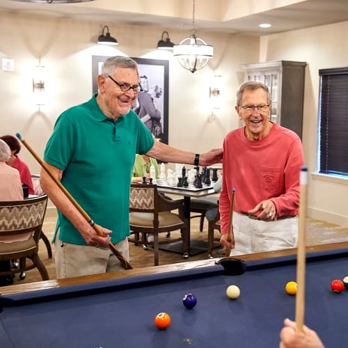 Residents playing pool at Celebration Village Acworth in Acworth, Georgia