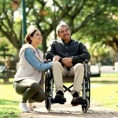 Person in the wheel chair in the park at Bella Vista Apartments in Santa Clara, California 