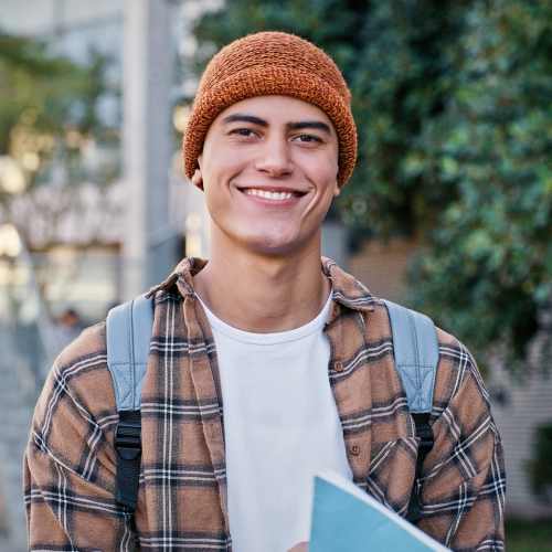 Student posing while going to library near The Edge in Pensacola, Florida