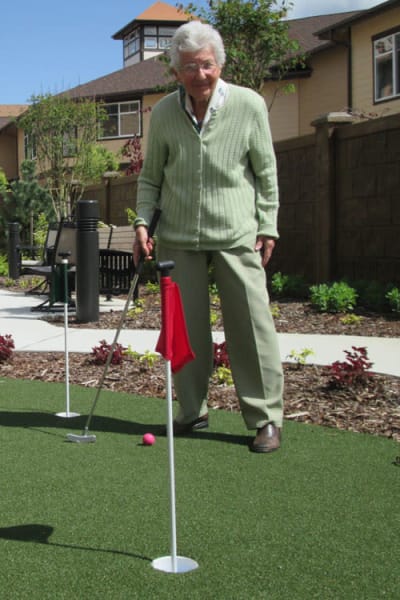 Senior man playing golf at Quail Park at Browns Point in Tacoma, Washington