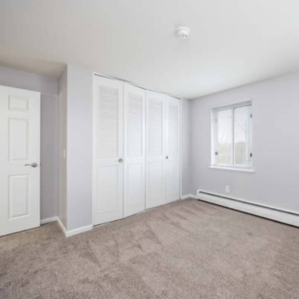 Bedroom with carpet flooring at Highland Bay Apartments in Rochester, New York