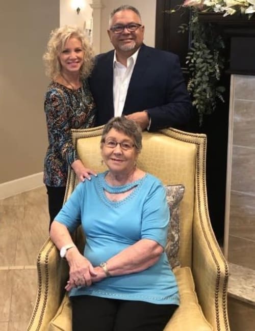 A female resident and her family at Inspired Living in Bonita Springs, Florida.