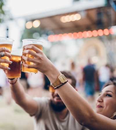 Residents sharing drinks near Elmore Apartments in Cincinnati, Ohio