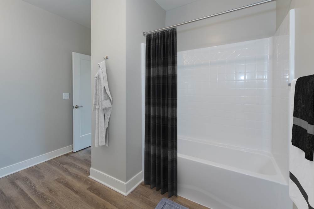 Spacious bathroom with shower curtain at Palmer's Creek, Fredericksburg, Virginia