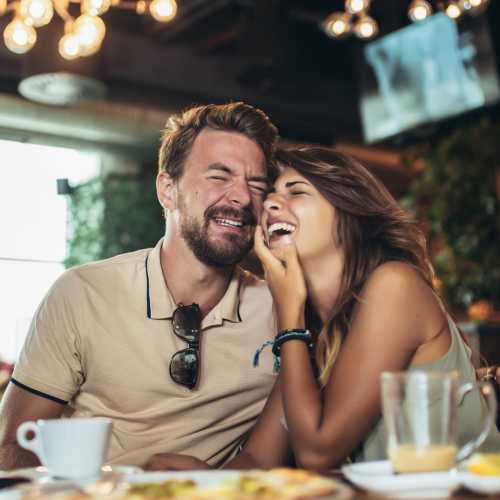 Resident couple having meal at a restaurant near District at 54 in Raleigh, North Carolina