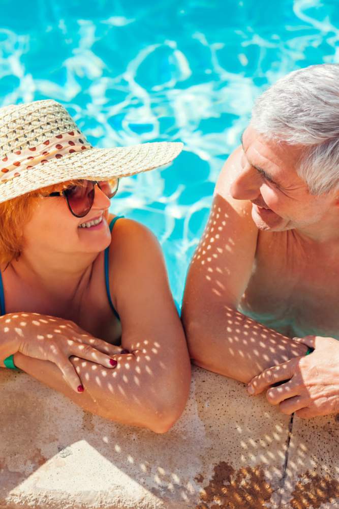 Resident enjoying in swimming pool at Heirloom at Torrey Pines in Las Vegas, Nevada