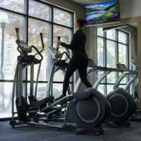 Resident working out in the gym at Trinity Bluff & Trinity District in Fort Worth, Texas