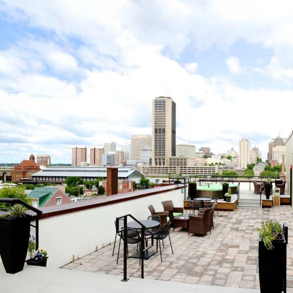 Rooftop deck with games and fire pit at Cedar Broad, Richmond, Virginia