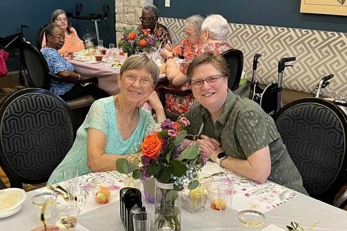 Friends enjoying a dinner together at Watercrest at Katy in Katy, Texas