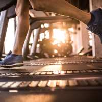 Resident running on the treadmill at Tapestry on Vaughn in Montgomery, Alabama, 