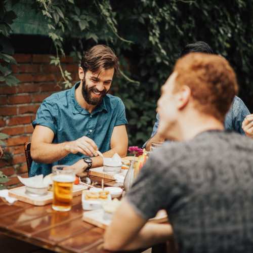 Couple of friends having food at Cotton Wood Apartments in Dublin, California