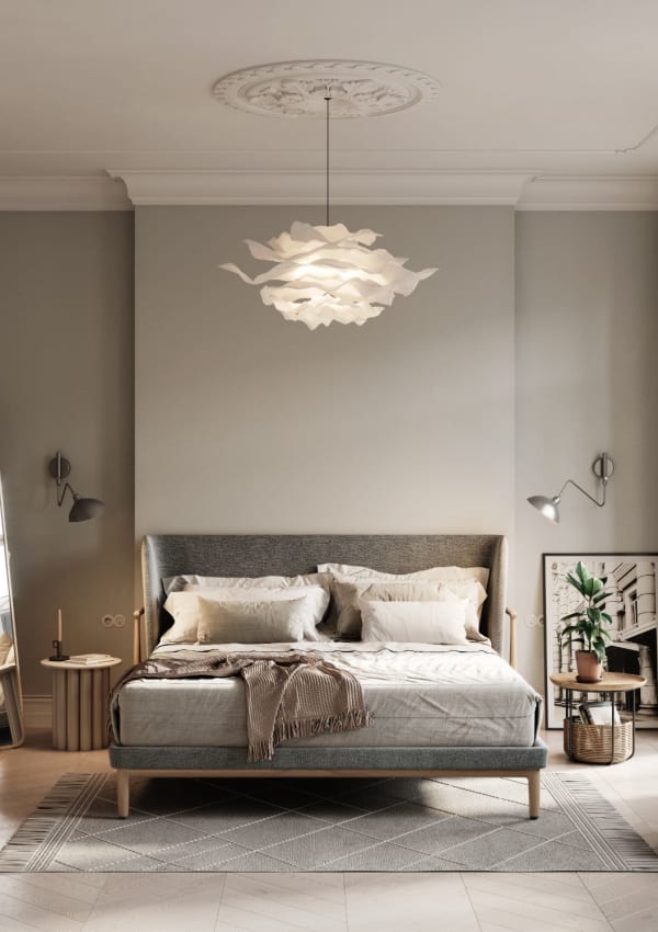 Model bedroom with a chandelier at The Gabriel in Leander, Texas