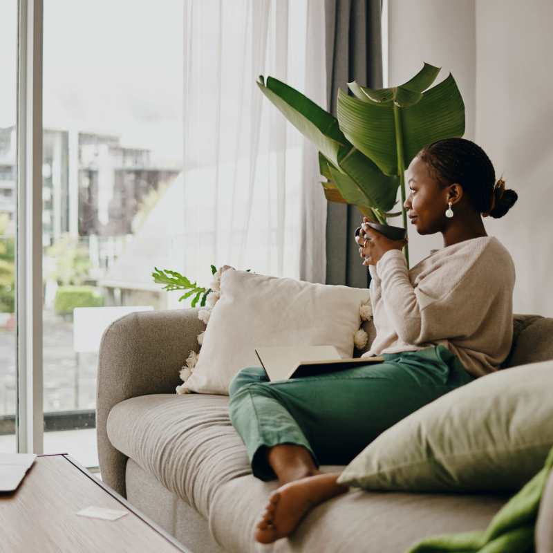 A resident sips coffee in her apartment at Commons on Potomac Square, Sterling, Virginia