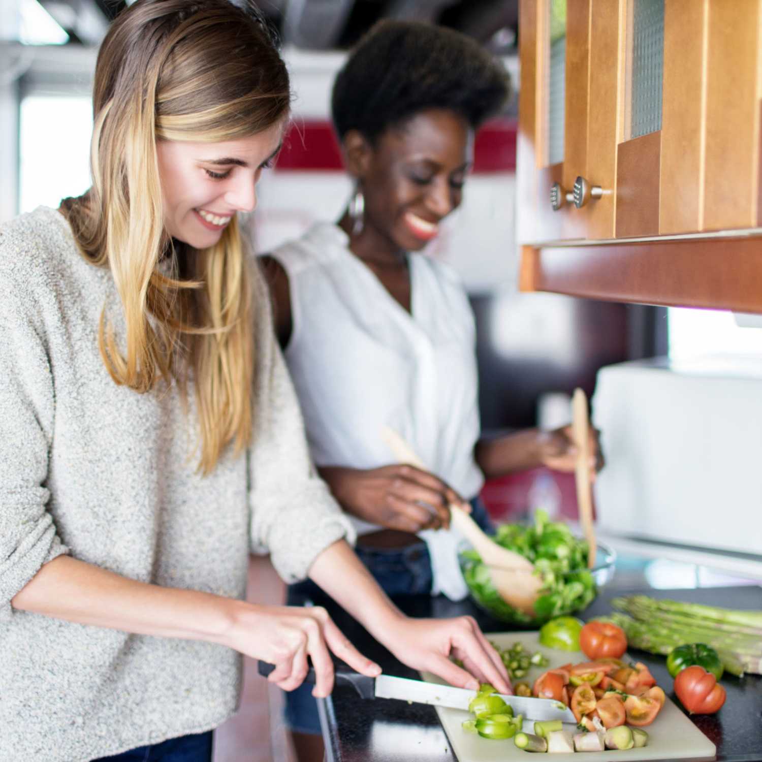 Resident couple cooking a meal in their kitchen at Beverly Villas in Brunswick, Georgia