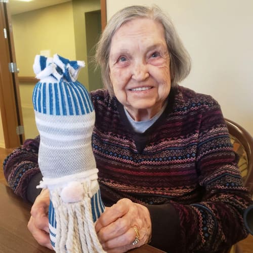 A happy resident outside of The Oxford Grand Assisted Living & Memory Care in Kansas City, Missouri
