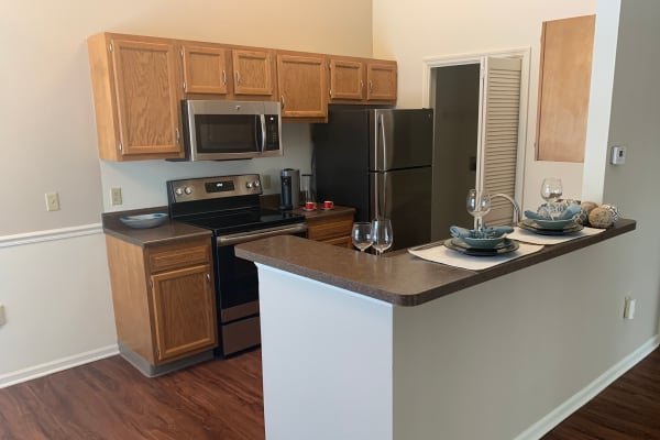 An apartment living room and kitchen at The Landings Apartments in Clifton Park, New York