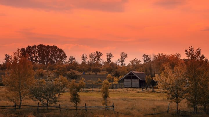Sunset behind a historic ranch building near Sundance Creek in Midland, Texas