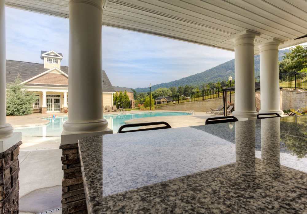 cabana view of pool and leasing office, mountains in background at Berrington Village in Asheville, North Carolina