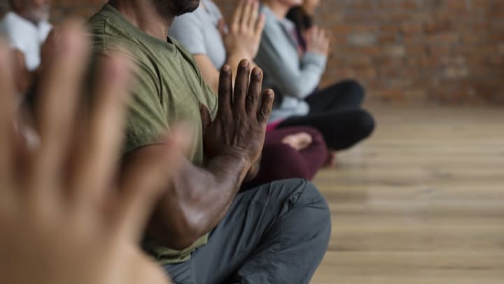 Students performing a yoga pose in a studio near Sedona Ranch in Odessa, Texas