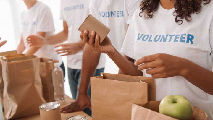Volunteers bagging canned food near Olympus Encantata in Albuquerque, New Mexico