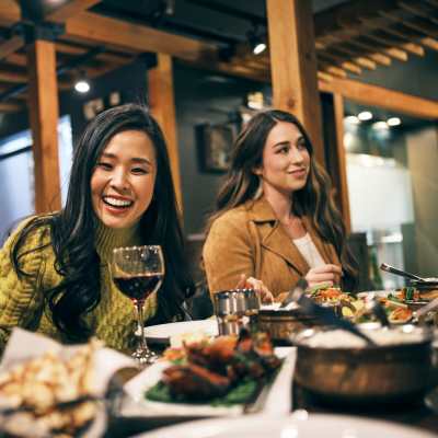 Friends having meals at nearby restaurant at Indigo Springs in Mesa, Arizona