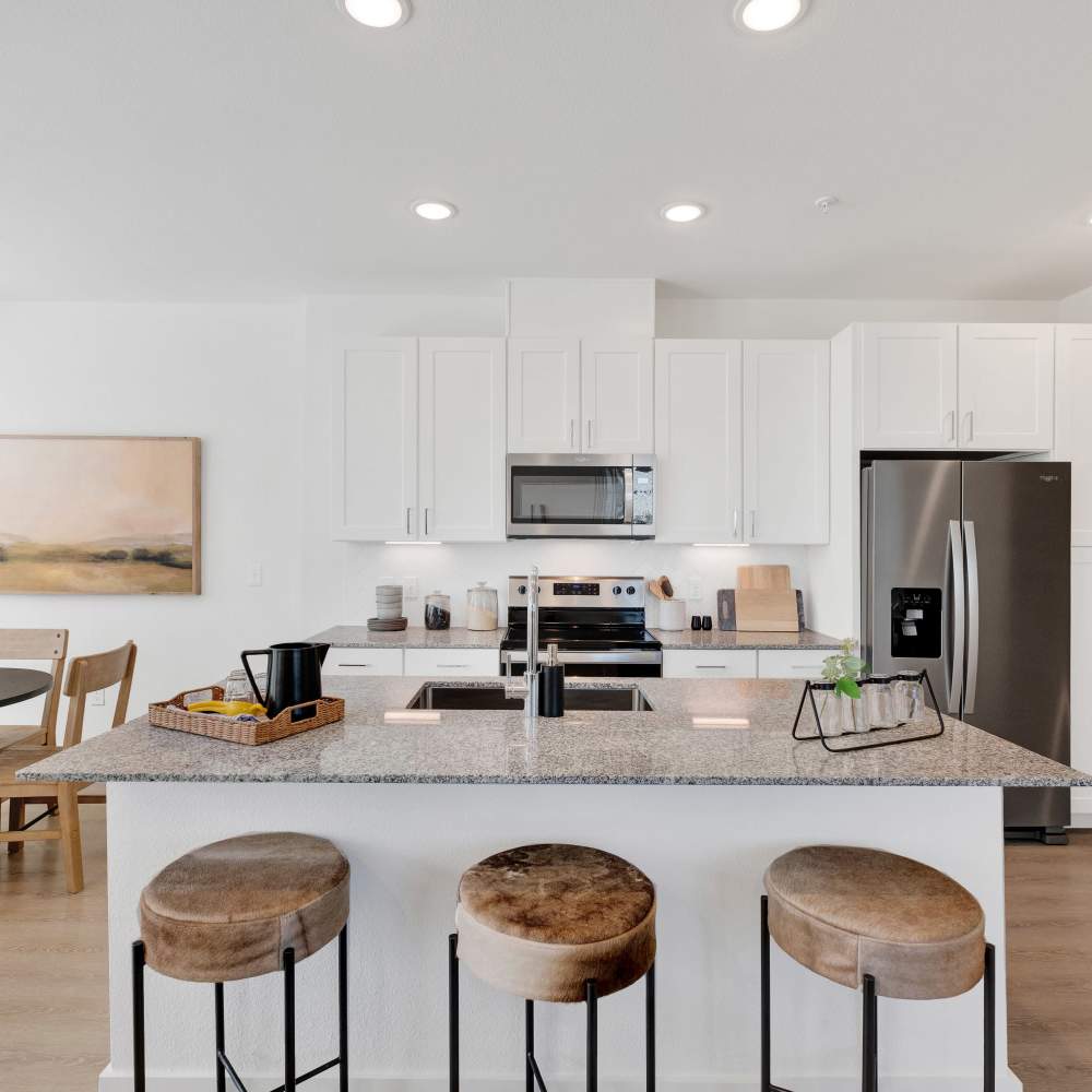 Bright kitchen with island at Caliza at The Loop in San Antonio, Texas