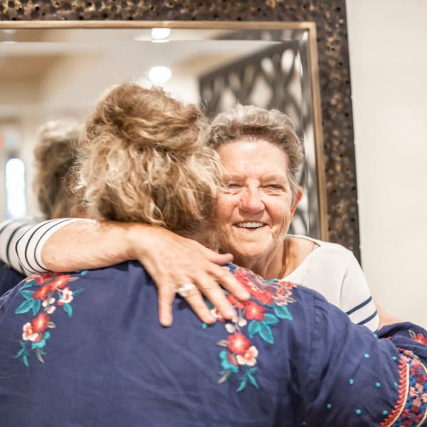 residents hugging at The Wildwood Senior Living in Joplin, Missouri