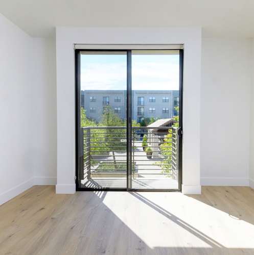 Doors to private balcony at 1801L Apartments in Sacramento, California
