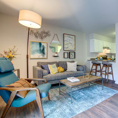 Breakfast bar and kitchen next to the living area of a model home at Terra Martinez in Martinez, California