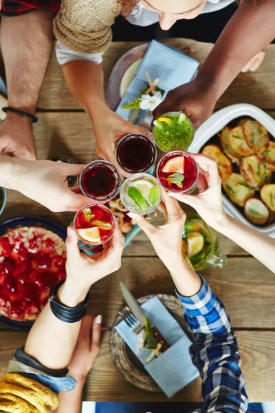 Resident friends raising a toast at their favorite restaurant near Solera at City Centre in Palm Beach Gardens, Florida