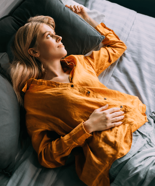 woman relaxing on couch at Parkline Palm Beaches