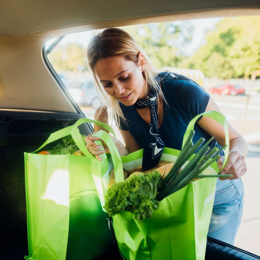 Woman loading groceries in the car near Twin Creeks in Antioch, California