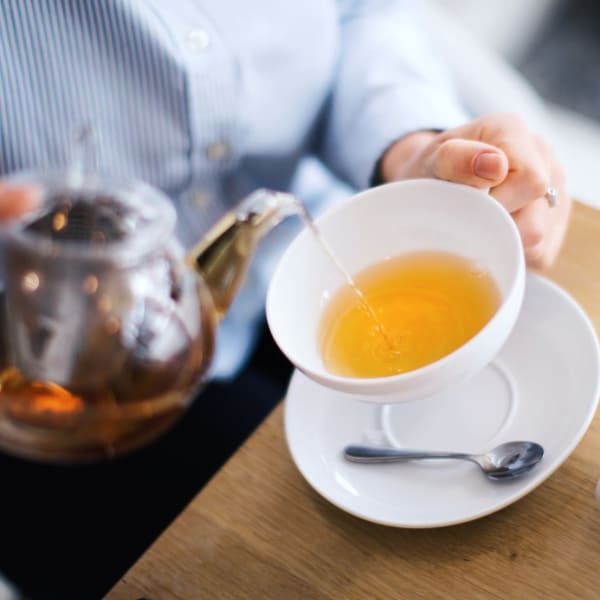 Pouring tea at Pacifica Senior Living Palm Beach in Greenacres, Florida. 