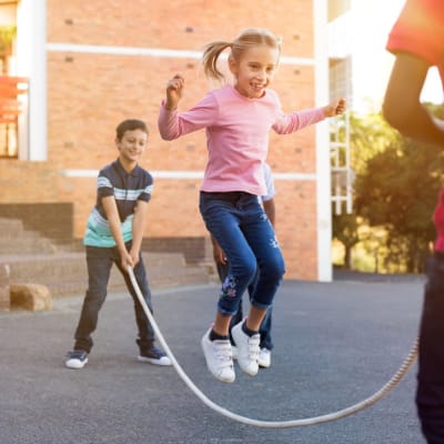 Kids jumping rope at a school near Columbia Colony in Patuxent River, Maryland