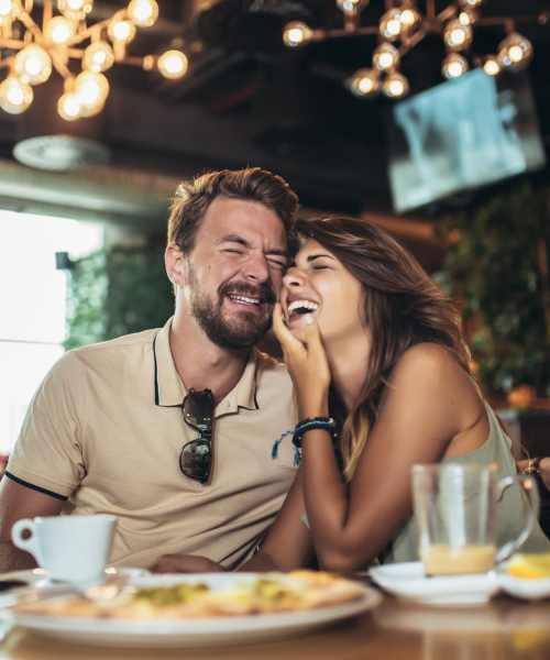 Happy couple having food in local restaurant near Norwood Walk in Troutman, North Carolina
