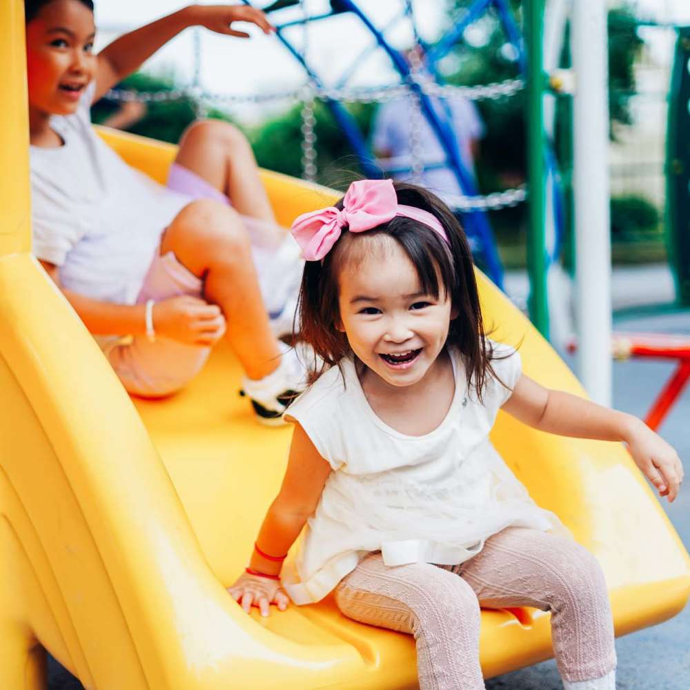 Kids using slide in playground at Signal Point Apartments in Mechanicsville, Virginia
