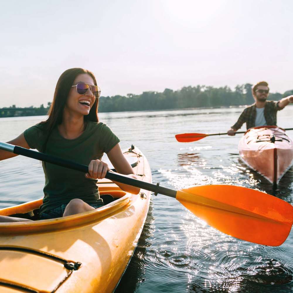 Resident couple kayaking near Park and 3rd Lofts in Alexandria, Minnesota
