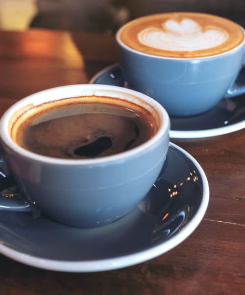 Two cups of coffee on a table near Lakeside of Cheshire in Cheshire, Connecticut